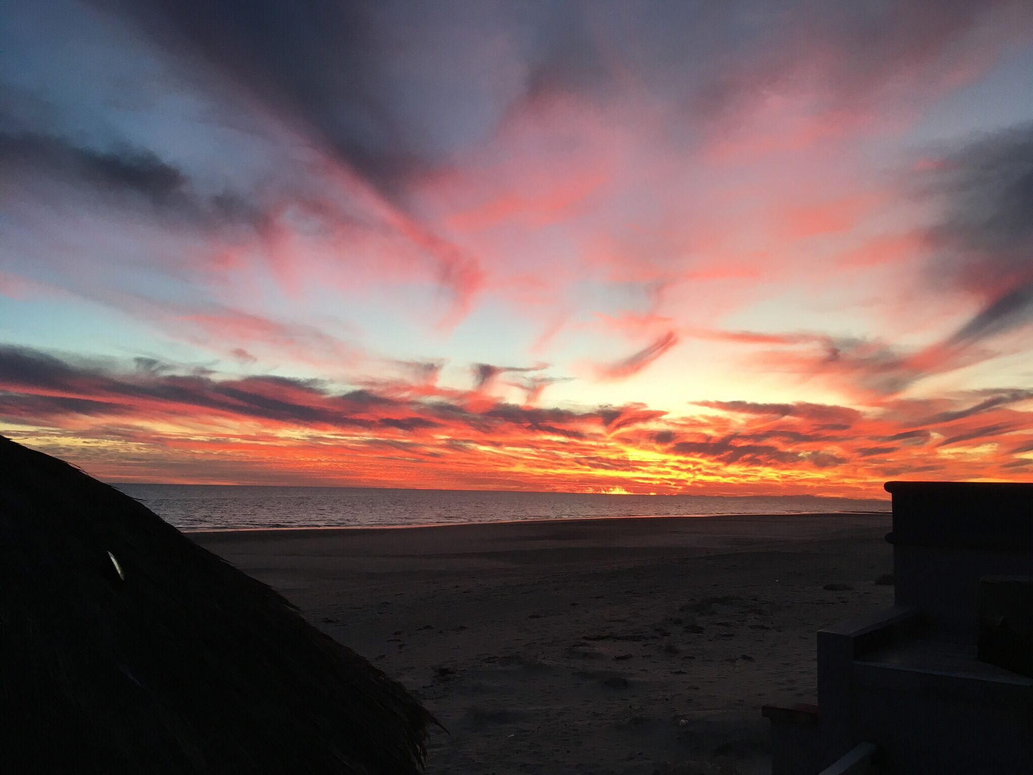 A beach with a sunset.