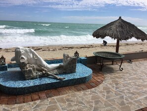 On the beach, sun loungers, beach towels