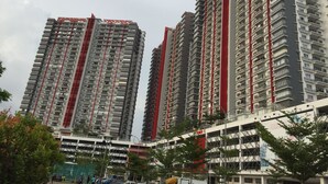 A high-rise residential building with multiple floors, balconies, and a prominent red and grey color scheme. - Puchong AR Home Koi Prima Condo (Puchong)