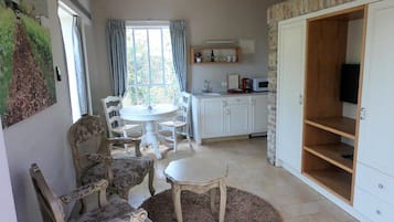 Deluxe Apartment, 1 Queen Bed | Living area | LCD TV