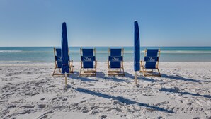 Four beach chairs with umbrellas at Crystal Beach. - Inn at Crystal Beach 404 * Gulf Front with Beach Chair Set. Onsite dining! (Destin)