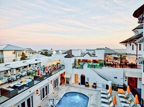 Relax in style on our rooftop terrace, featuring lounge chairs, umbrellas, and a refreshing pool.