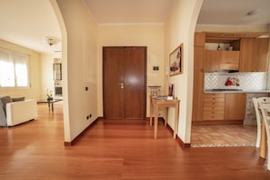 Cozy living space with a dining area and kitchen, perfect for relaxing and preparing meals.