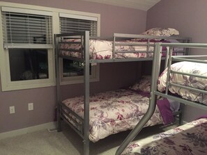 A bunk bed room with a window and a door. - Oceanfront/ Beachfront  Home on Sand Hills Scituate  (Scituate)