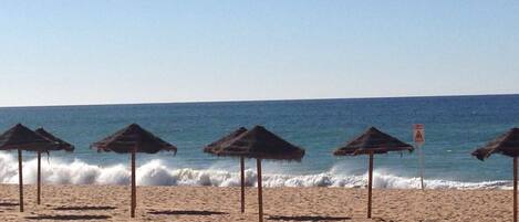 On the beach, sun-loungers, beach towels