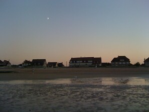 A coastal area with houses and a beach.