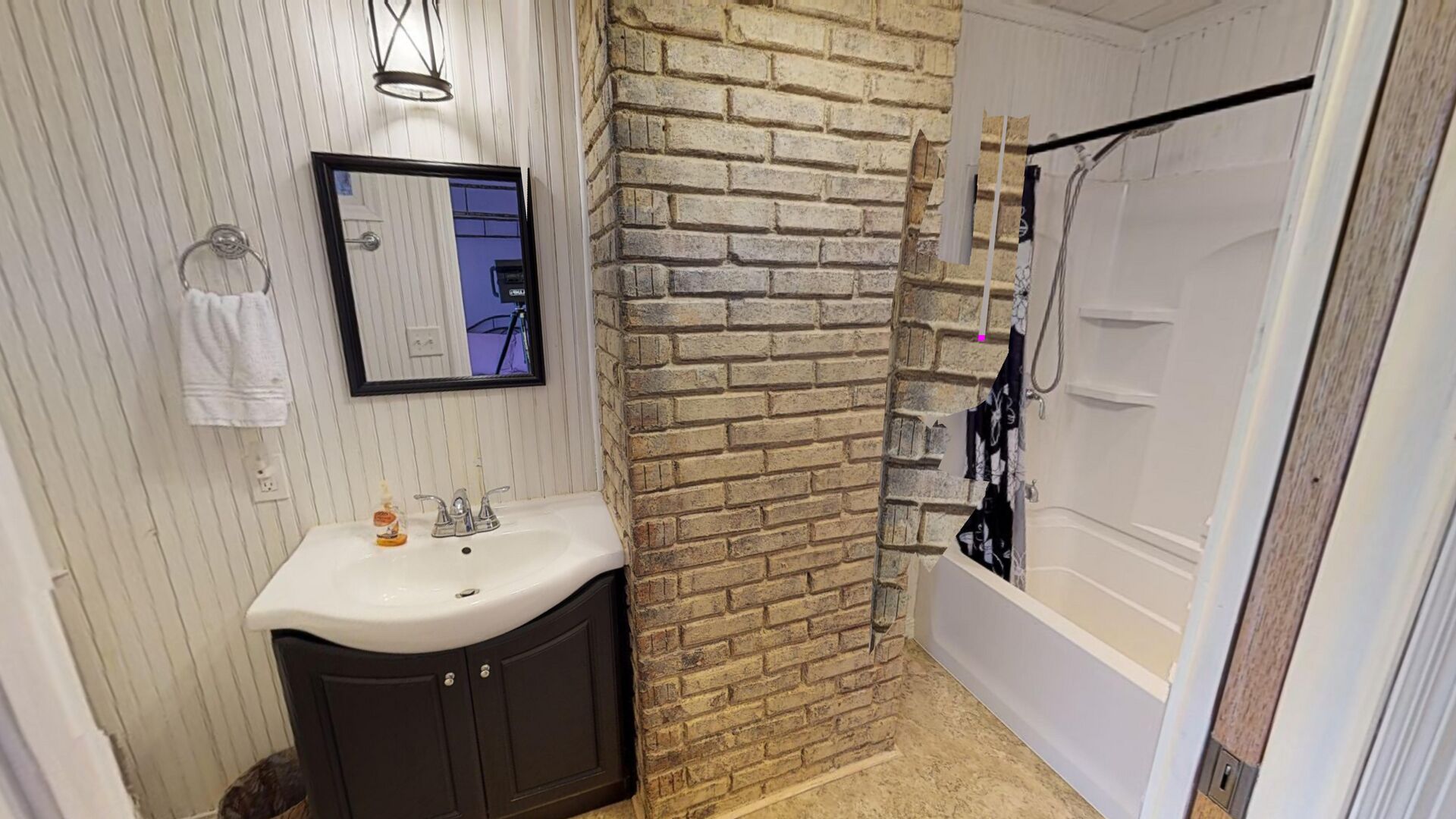 Combined shower/bathtub, towels, soap, shampoo