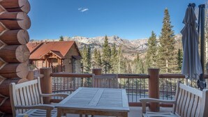 A wooden cabin with a balcony overlooking a mountainous landscape. - Villas At Tristant 127 (Mountain Village)