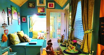 Peaceful Secret Gardens Tiny Home - loft & stairs lead to a Queen Size Bed