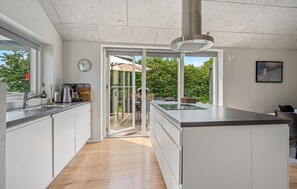 Fridge, stovetop, dishwasher, coffee/tea maker