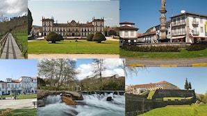 A series of buildings with classical architecture, including a large ornate building with a symmetrical facade and a smaller building with a statue in front. - Hotel Vila Esteves (Monção)