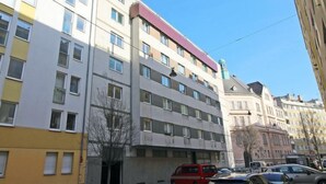 A multi-story building with a modern architectural style, featuring a mix of residential and commercial spaces. - Vienna waits for you by Interhome (Vienna / 5. District)