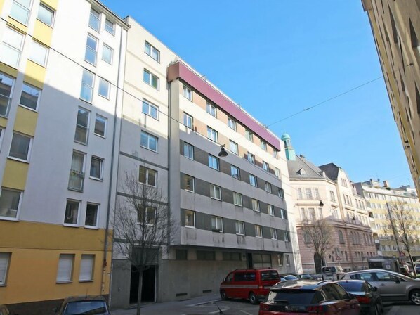 A multi-story building with a modern architectural style, featuring a mix of residential and commercial spaces. - Vienna waits for you by Interhome (Vienna / 5. District)