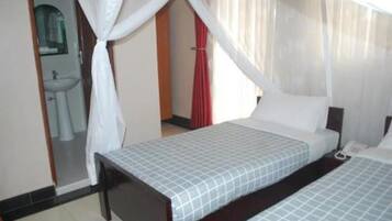 Twin Room (No A/C) | Individually decorated, individually furnished, desk, bed sheets