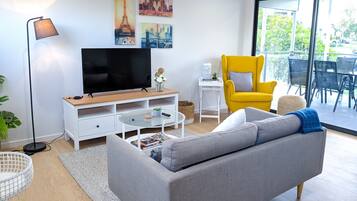 Deluxe Apartment, 3 Bedrooms | Living area | LED TV