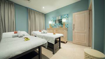 Two comfortable beds with crisp linens and a convenient table in between.