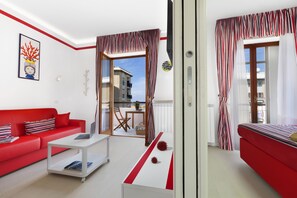 Deluxe Apartment, 1 Bedroom, Balcony | Living area | 43-inch flat-screen TV with digital channels, Smart TV - Maison Iolanda (Piano di Sorrento)