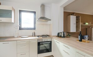 Fridge, stovetop, dishwasher, coffee/tea maker