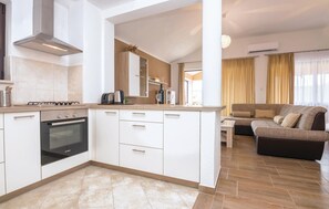 Fridge, stovetop, dishwasher, coffee/tea maker