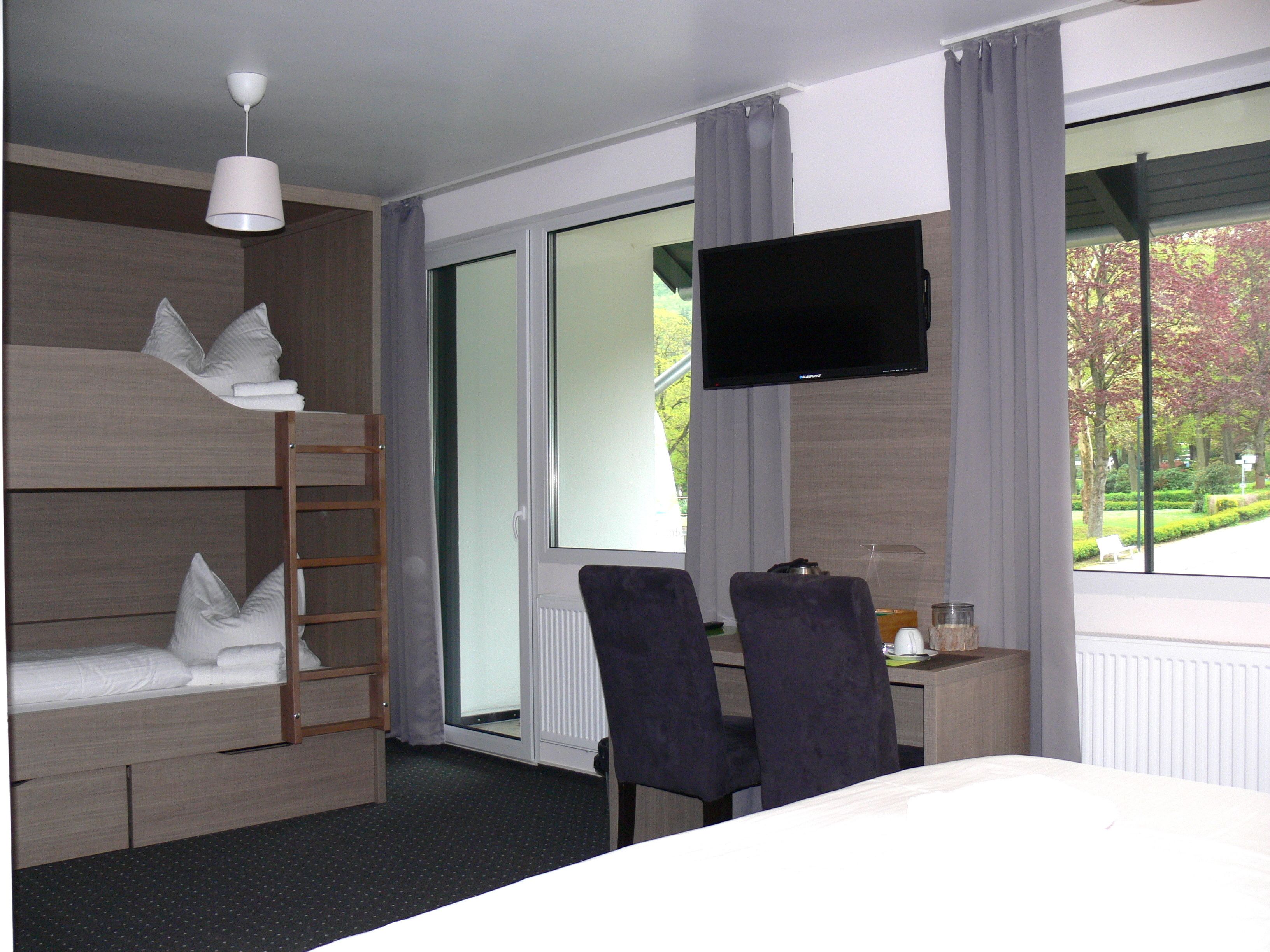 Hypo-allergenic bedding, down duvets, in-room safe, desk