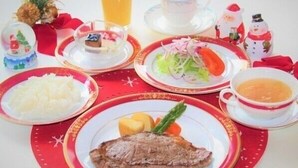 A table set with plates of food, a glass of juice, and a cup of coffee. - Hotel Shirahagi (Sendai)