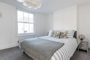 Premium bedding, memory-foam beds, blackout curtains, iron/ironing board