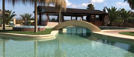 Outdoor pool, open 8:00 AM to 8:00 PM, pool umbrellas, pool loungers