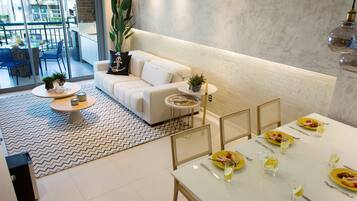 Apartamento superluxo | Sala de estar | TV de tela plana