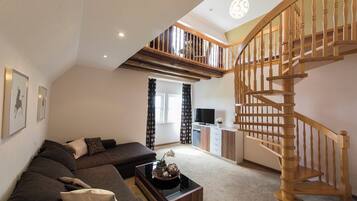 rebland.suite | Wohnbereich | 26-Zoll-Flachbildfernseher mit Kabelempfang