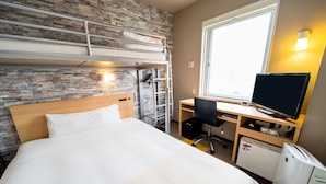 A hotel room with a bunk bed, a desk with a computer and TV, a small kitchenette, and a window with a view. - Super Hotel Takamatsu Kinenkan (Takamatsu)