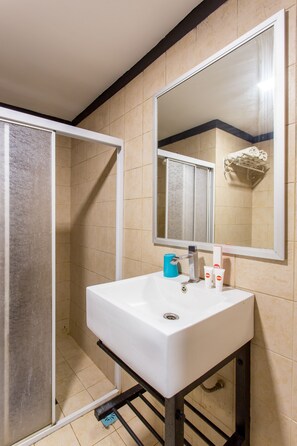 Shower, rainfall showerhead, towels