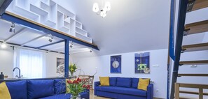 家庭公寓 | 起居区 | 55-英寸智能电视 （配备卫 星频道）、电视