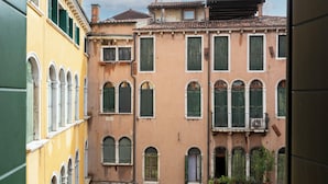 A row of historic buildings with arched windows and balconies. - Numa Venice Palazzo Orseolo (Venice)