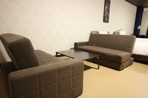 Family Room | Living area | Flat-screen TV - White Beachi inn Ishikawa (Uruma)