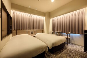 Corner Twin, Non-Smoking | Desk, laptop workspace, blackout drapes, iron/ironing board