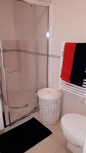 Shower, hair dryer, towels, soap
