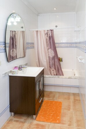 Combined shower/tub, hair dryer, towels, soap