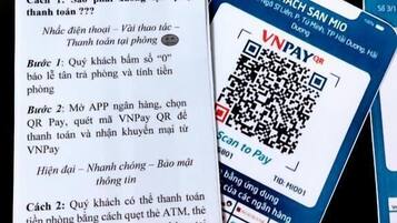 A card with text and QR codes, possibly for a payment or information system.