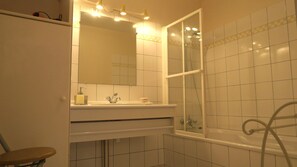 Bathtub, hair dryer, towels, soap