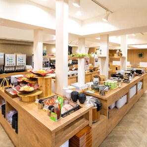 A buffet setup with various food items and condiments. - Super Hotel Ikebukuro-Eki Kitaguchi (Tokyo)