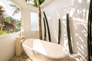 Bathtub, hair dryer, towels