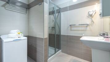 A2 - Superior Apartment, Sea View | Bathroom | Shower, hair dryer, towels, soap