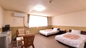 A hotel room with two beds, a desk with a computer, a chair, and a window with curtains. - Hotel Million (Muroran)