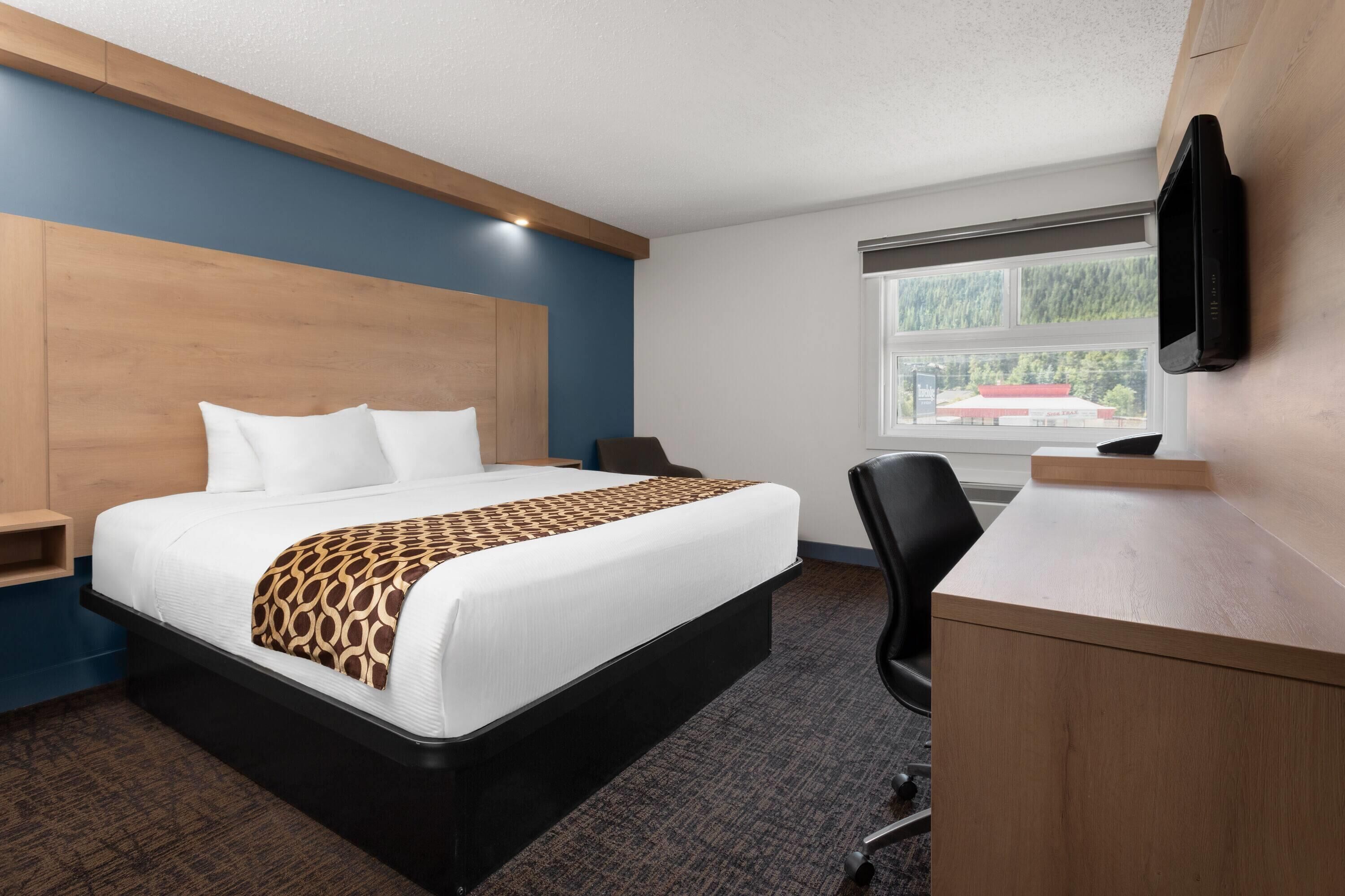 desk, laptop workspace, blackout curtains, iron/ironing board