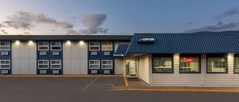A building with a reception area and multiple windows.