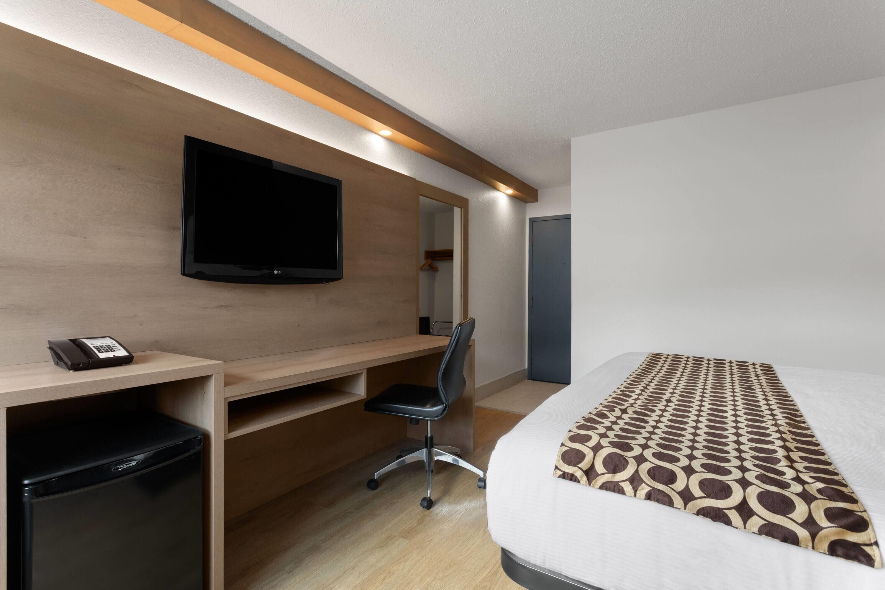 desk, laptop workspace, blackout curtains, iron/ironing board