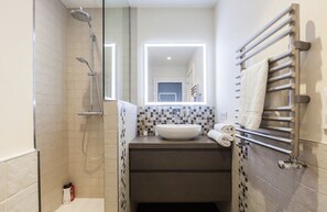 Bathtub, hair dryer, towels, soap