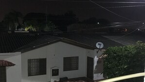 A building with a tiled roof, a satellite dish, and a gated entrance. - Villa Ensueño - House with Pool & Hot Tub (Flandes)