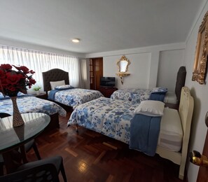 Family Quadruple Room, Courtyard View | Minibar, individually decorated, individually furnished - Residencial Belle Maison (Cusco)