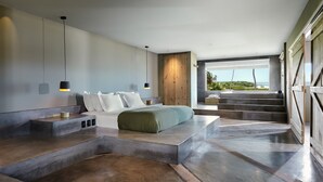 A modern bedroom with a large bed, a wooden wardrobe, and a view of the outdoors. - Casa Uca (Camocim)